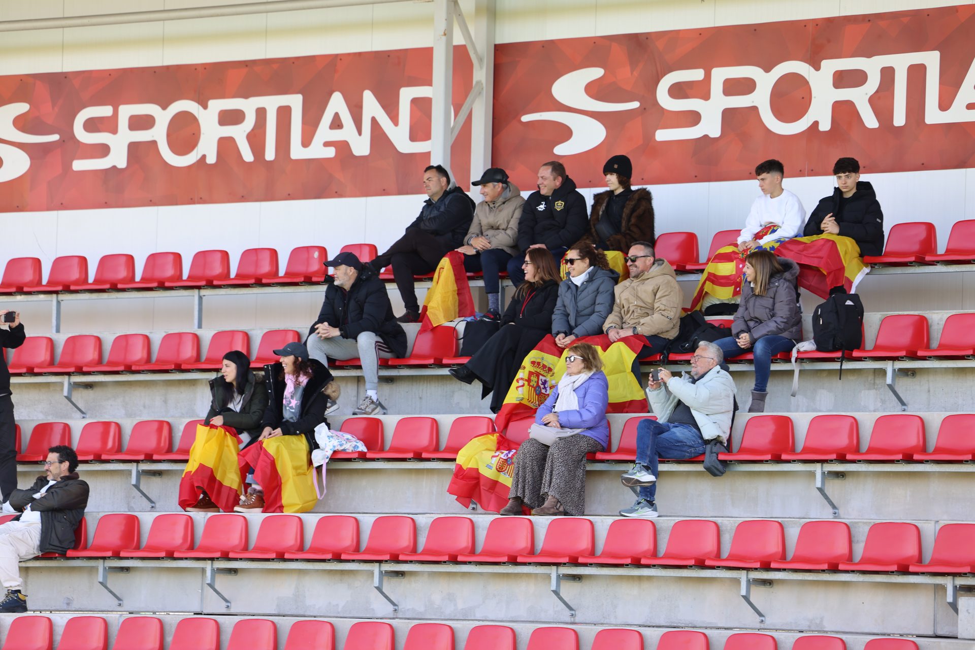 Families with flags in the Sportland stands